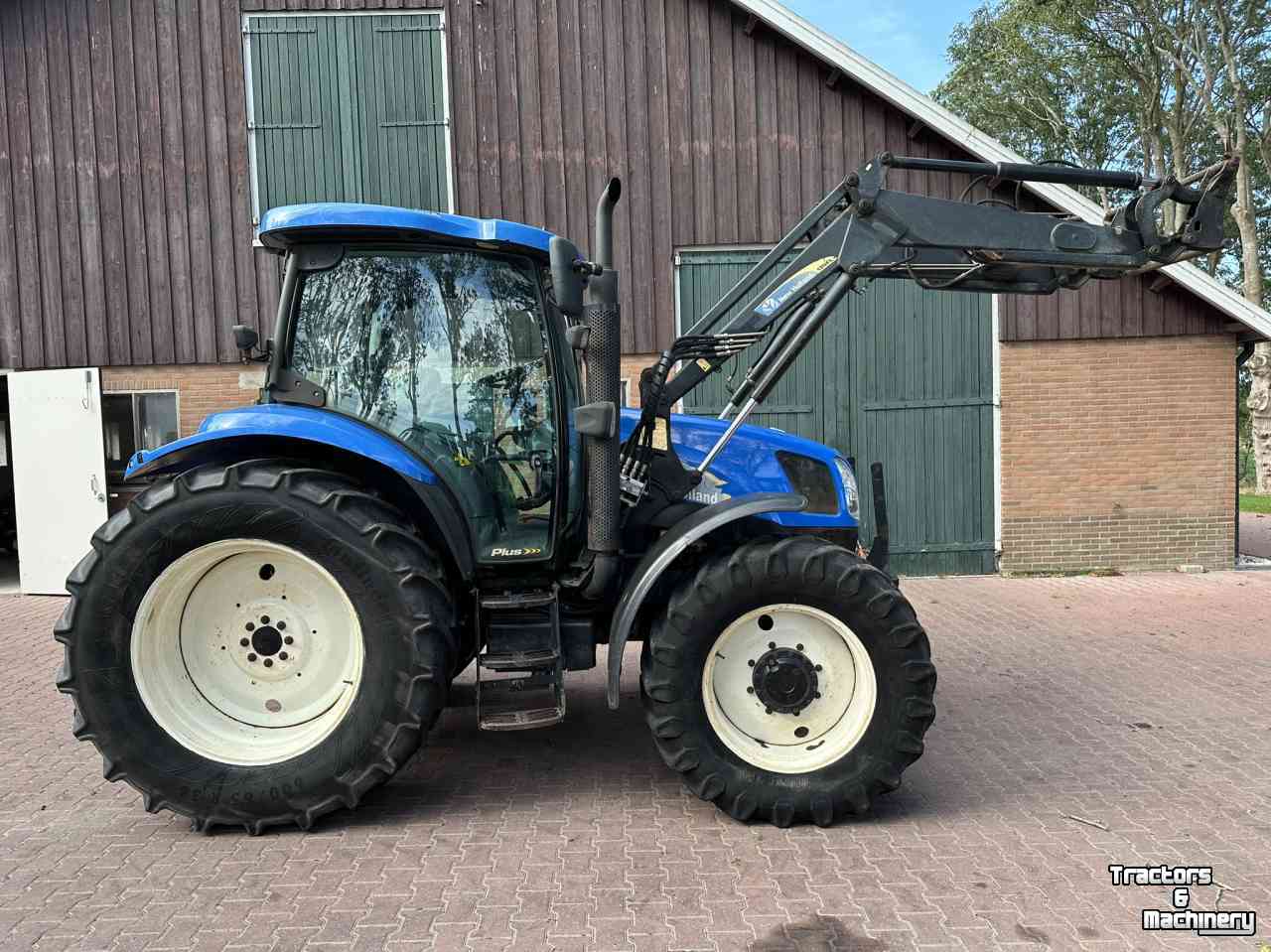 Traktoren New Holland TS100A met voorlader