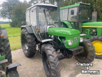 Traktoren John Deere 1950 MC-1 cab.